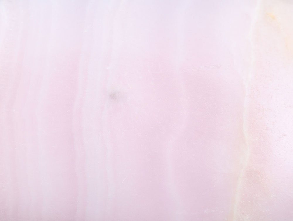 Manganocalcite rose pâle brute cristal minéral — histoire, découverte du manganèse et tradition lithothérapie