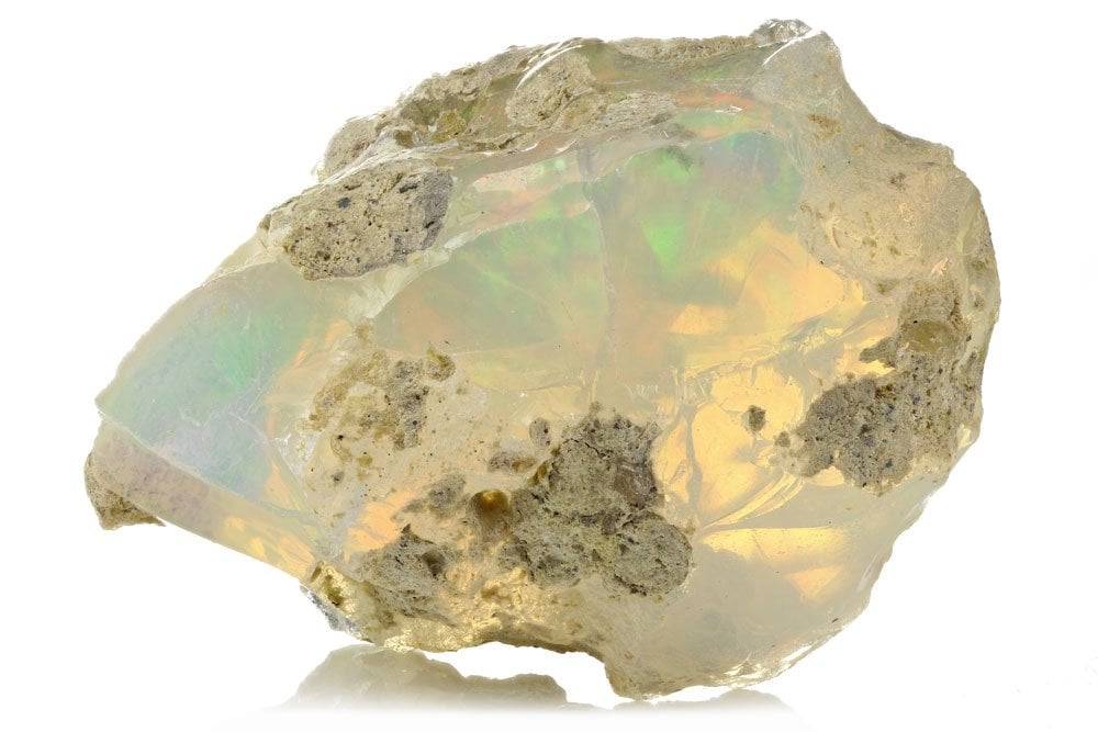 Opale blanche polie - jeu de couleurs iridescent, structure siliceuse, gisements australiens Coober Pedy