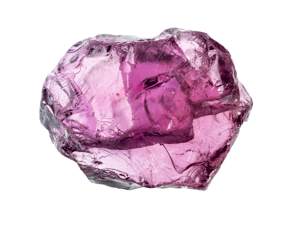 Rhodolite brute montrant ses teintes rose-violet caractéristiques — grenat naturel mélange de pyrope et almandin