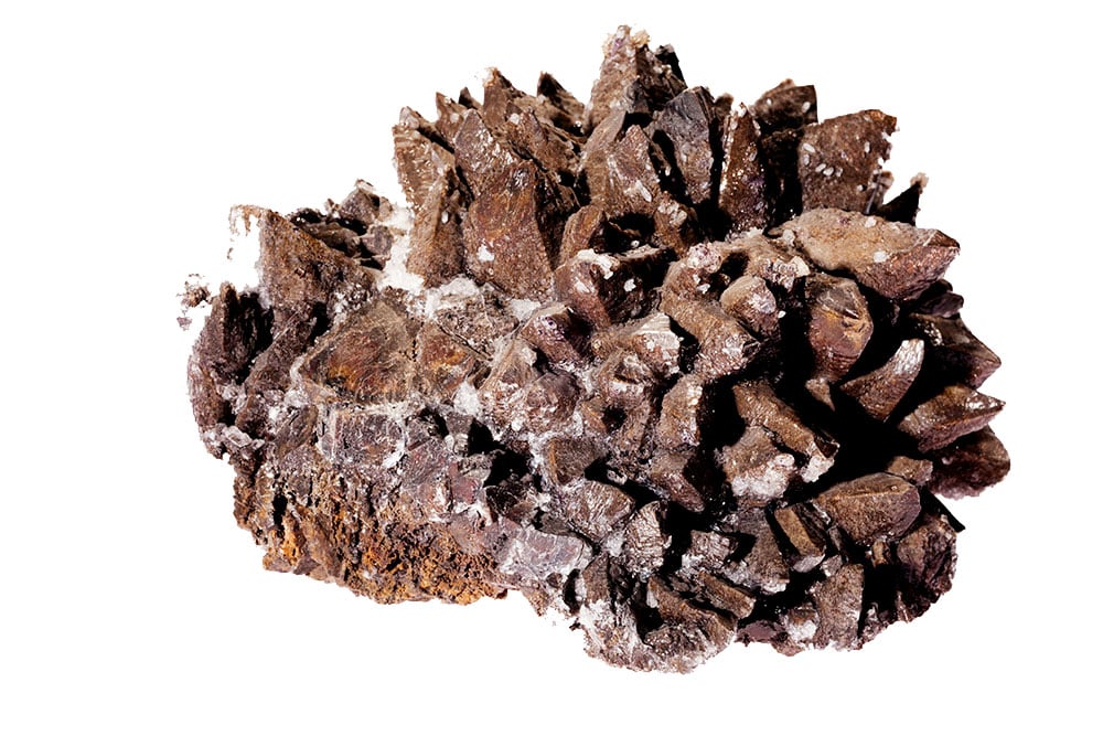 Cristaux de sidérite rhomboédriques du Massif des Alpes françaises - carbonate de fer brun-doré, histoire minéralogique