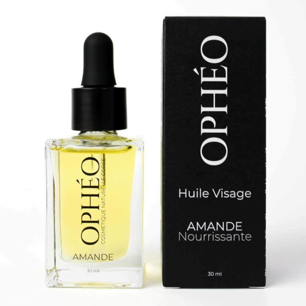 Un flacon d'Huile Visage Amande Nourrissante de la marque OPHÉO, accompagnée de son emballage carton, noir et blanc au style élégant et épuré.